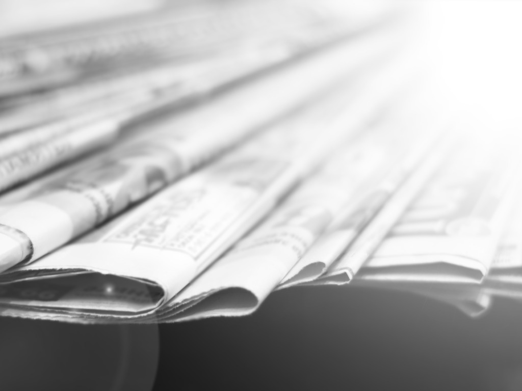 Newspapers,Folded,And,Stacked,In,A,Pile.,Old,Journals,With